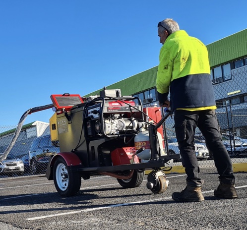 Crack sealer being used by Pothole People Qld staff member